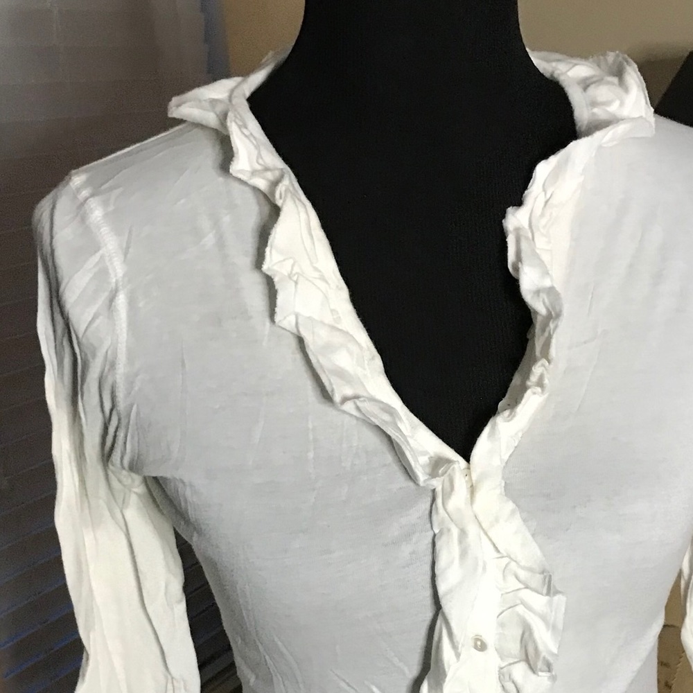 Women’s cream deep vneck knit top.